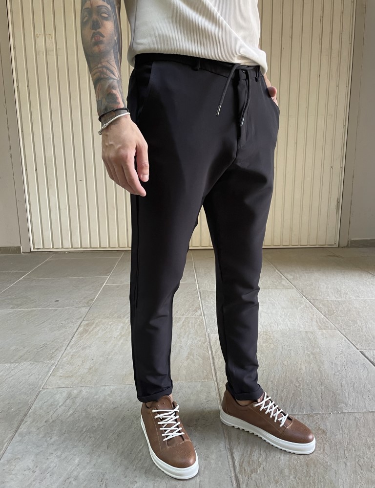 Ανδρικό υφασμάτινο παντελόνιμε κορδόνι κ κουμπί στη μέση. Διαθέτει τσέπες και ρεβέρ στο τελείωμα του.Κανονική εφαρμογήΣύνθεση: 70% pol. 3% lyc. 27% viscTο μοντέλο έχει ύψος 1.70 και βάρος 68 κιλά. Φοράει S